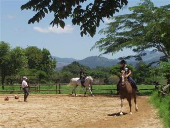 Ann giving riding lesson